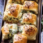 Pull Apart Garlic Butter Spinach and Artichoke Dip Sliders.